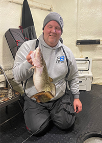 Ice Fishing For Burbot From A Fish House - Catch Cover